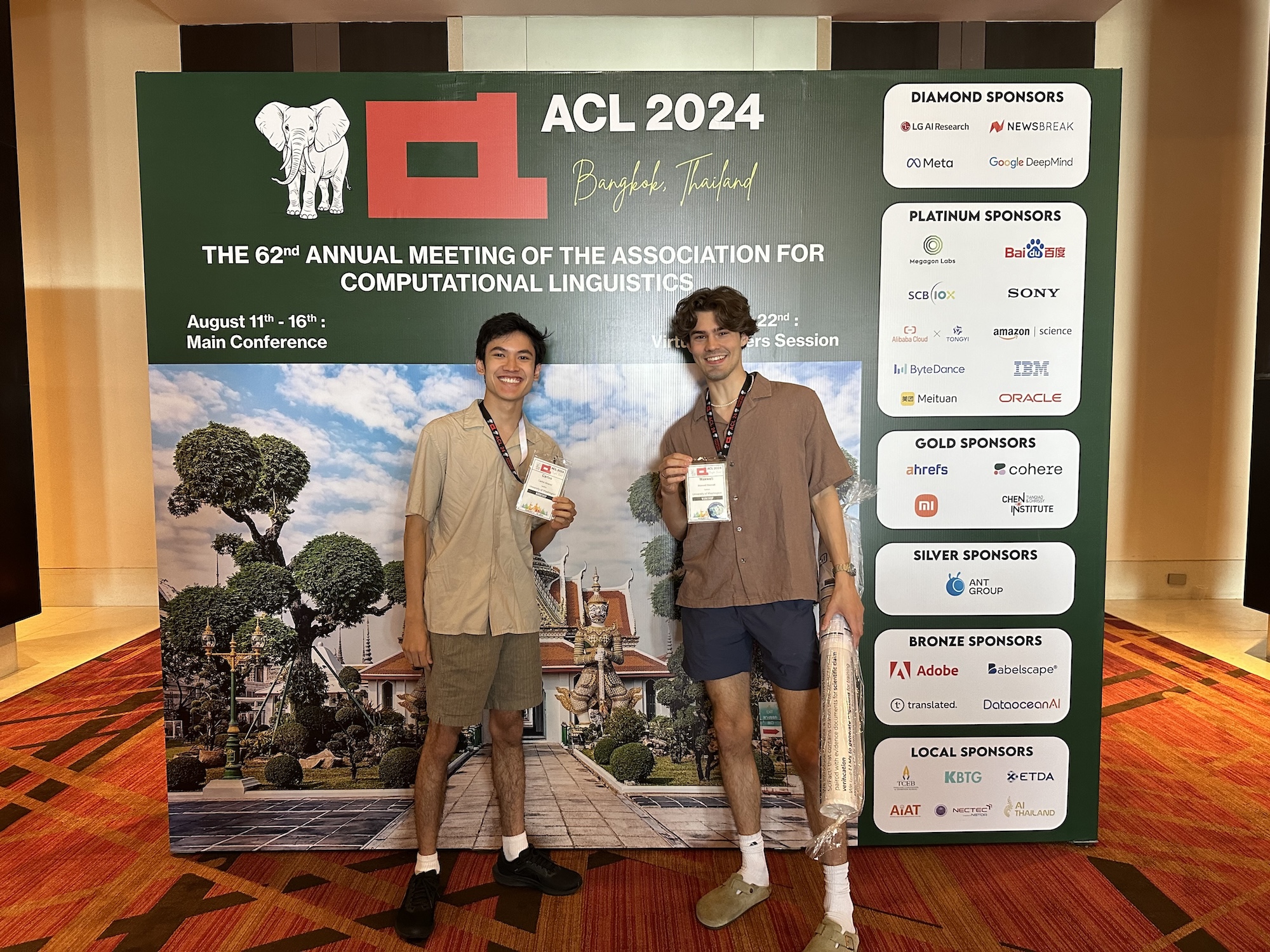 photo of carlos and max in front of the ACL 2024 sign